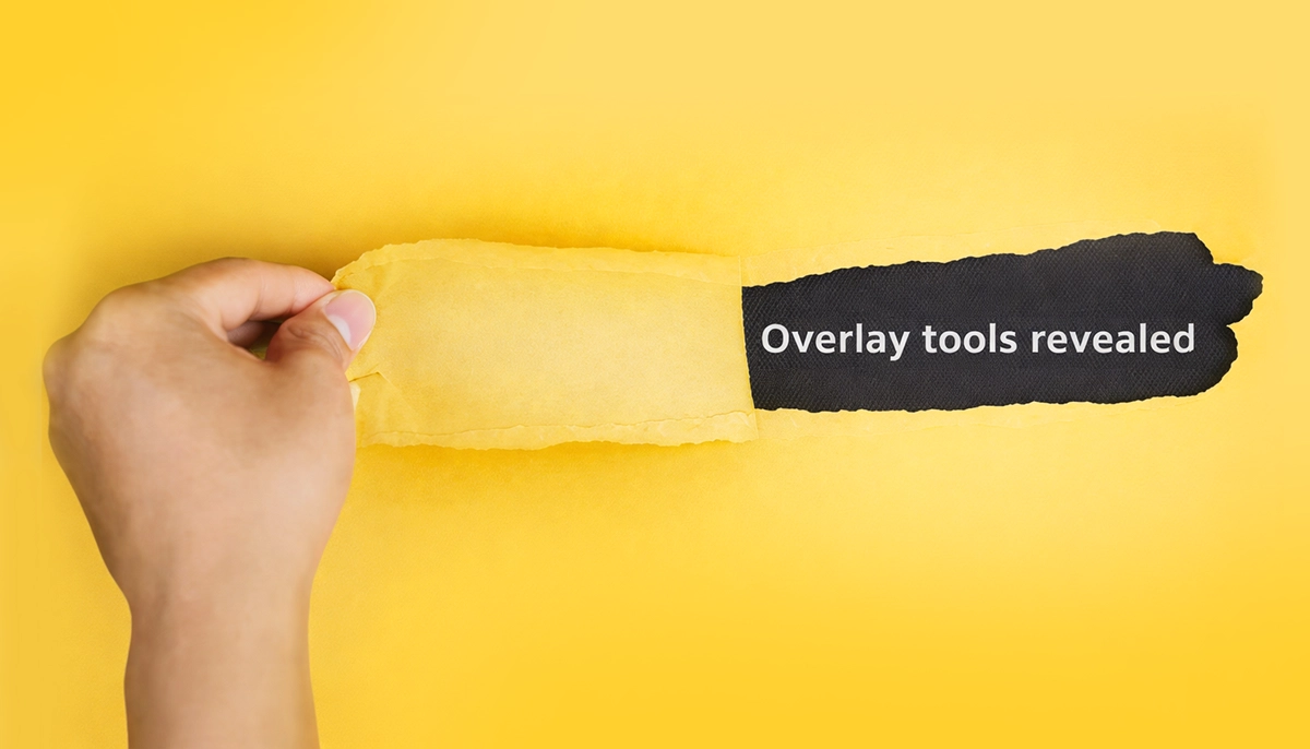 Une main affichant le message « Outils de superposition affichés », symbolisant l'activation des outils de superposition d'accessibilité.